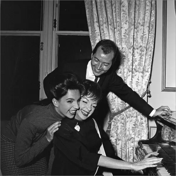 Liza Minnelli, 18, is pictured with her mother Judy Garland, 42, and Mark Herron