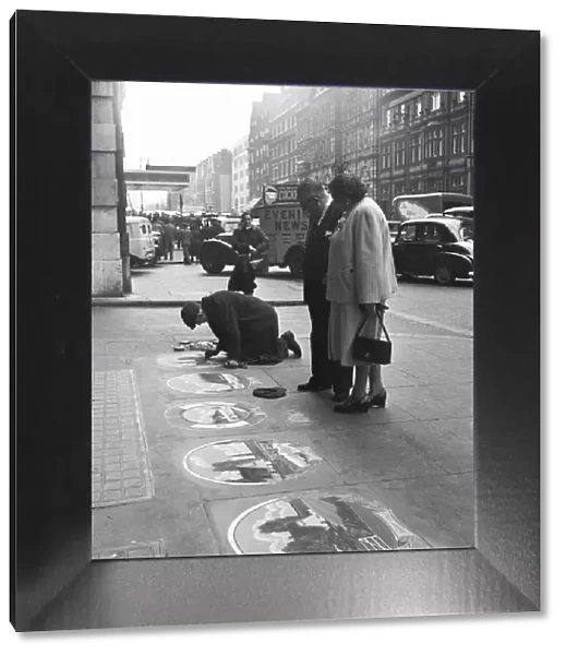 Pavement artist at work at Victoria Station, London, 21st May 1954