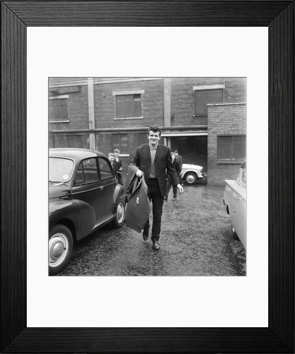 Framed Print : Liverpool goalkeeper Tommy Lawrence picks up his new suit ahead of the team Framed Print : Liverpool goalkeeper Tommy Lawrence picks up his new suit ahead of the team
