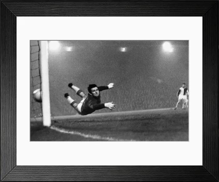 Framed Print : Liverpool goalkeeper Tommy Lawrence in action during the English League Division One Framed Print : Liverpool goalkeeper Tommy Lawrence in action during the English League Division One