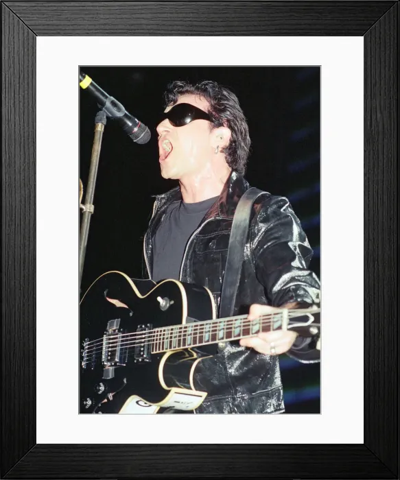 Framed Print : U2 in concert on the Zoo TV Tour, Wembley Stadium. Bono performing on stage Framed Print : U2 in concert on the Zoo TV Tour, Wembley Stadium. Bono performing on stage