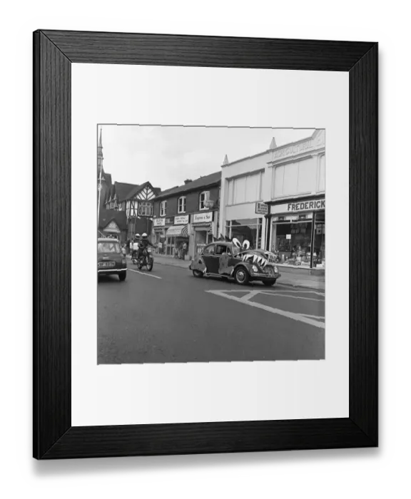 Framed Print : A decorated VW Beetle drives along Bridge Road, Stafford to promote the new