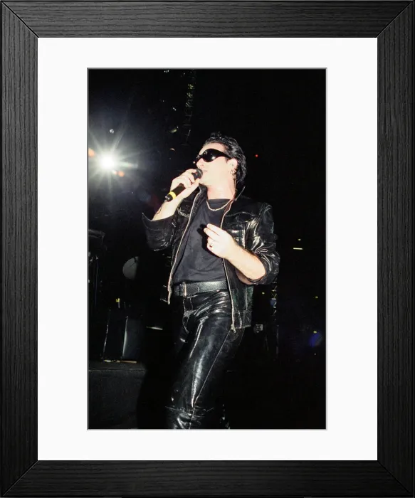 Framed Print : U2 in concert on the Zoo TV Tour, Wembley Stadium. Bono performing on stage Framed Print : U2 in concert on the Zoo TV Tour, Wembley Stadium. Bono performing on stage