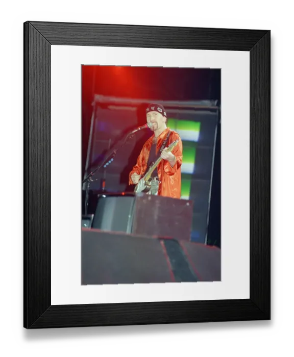 Framed Print : U2 in concert, Zoo TV Tour, Wembley Stadium. The Edge pictured on stage. 11th August 1993