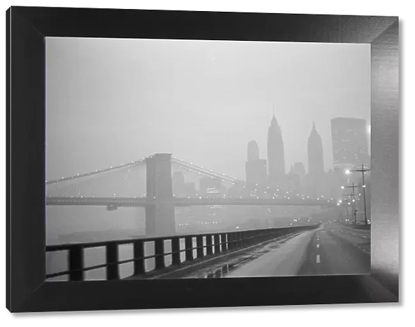 New York skyline and Brooklyn Bridge seen from the FDR Drive freeway, Manhattan, New York