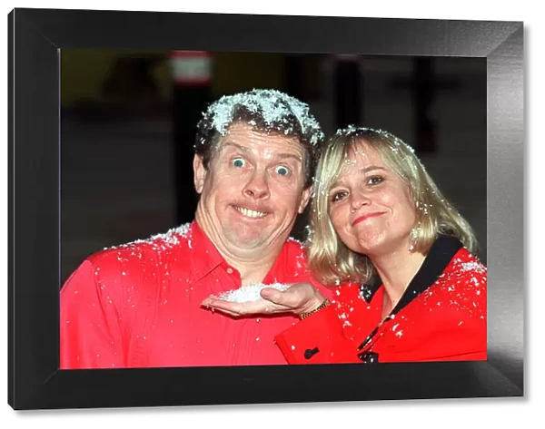 Phil Cool comedian and actress Susan Penhaligon Nov 1990 covered in snow