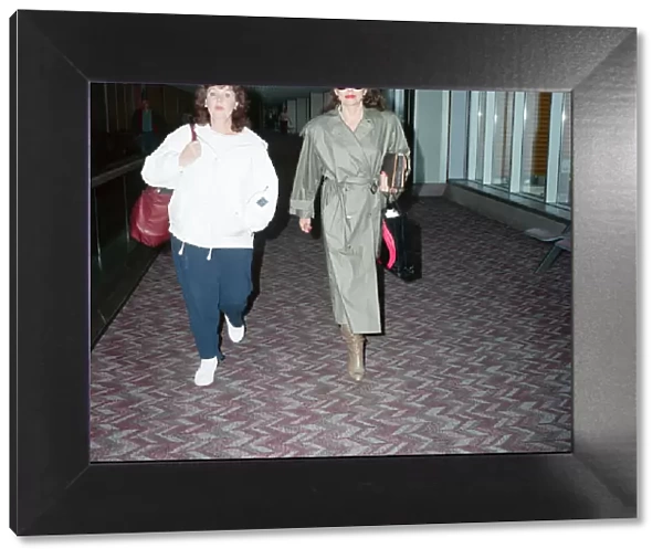 Actresses Joan Collins and Pauline Collins at Heathrow Airport. 8th April 1990