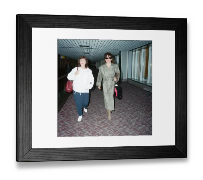 Framed Print : Actresses Joan Collins and Pauline Collins at Heathrow Airport. 8th April 1990 Framed Print : Actresses Joan Collins and Pauline Collins at Heathrow Airport. 8th April 1990