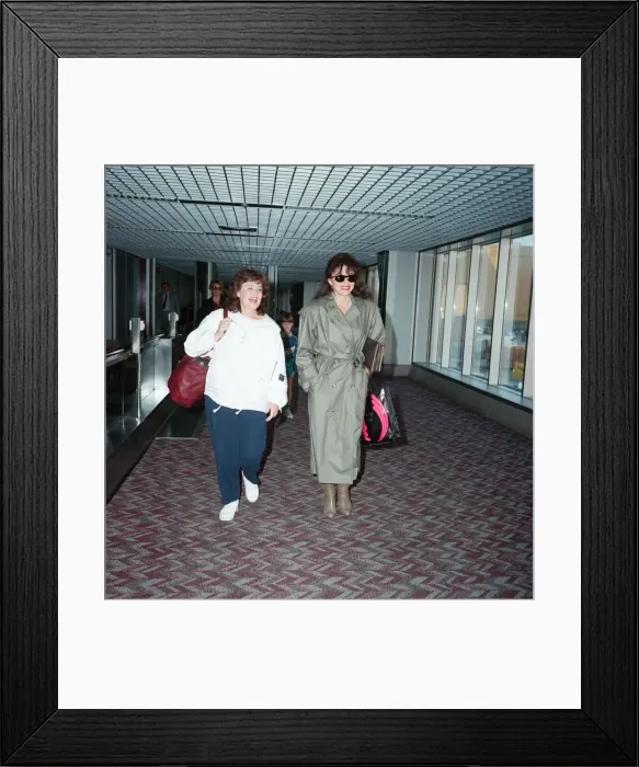 Framed Print : Actresses Joan Collins and Pauline Collins at Heathrow Airport. 8th April 1990 Framed Print : Actresses Joan Collins and Pauline Collins at Heathrow Airport. 8th April 1990