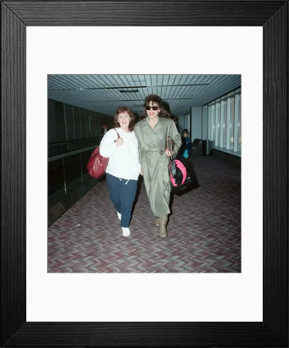 Framed Print : Actresses Joan Collins and Pauline Collins at Heathrow Airport. 8th April 1990 Framed Print : Actresses Joan Collins and Pauline Collins at Heathrow Airport. 8th April 1990