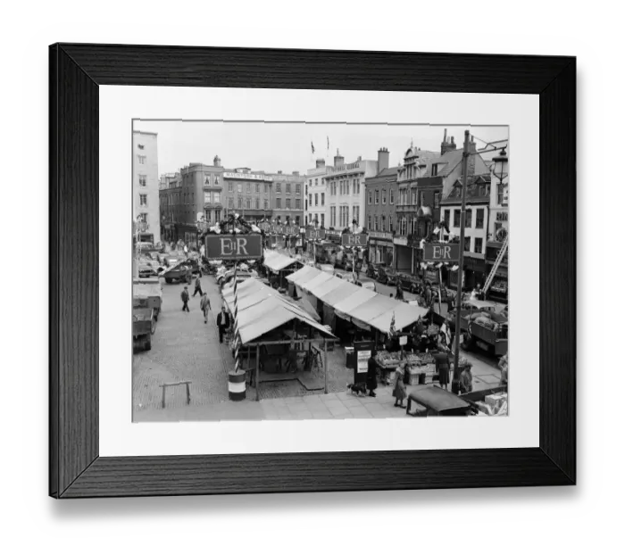 Framed Print : Flags fluttering in the breeze, decorations in traditional colours lining the streets Framed Print : Flags fluttering in the breeze, decorations in traditional colours lining the streets
