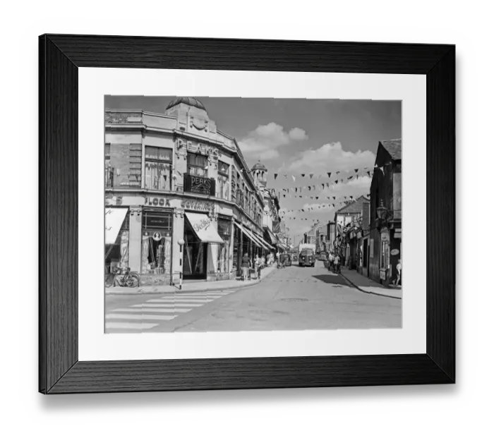 Framed Print : Flags fluttering in the breeze, decorations in traditional colours lining the streets
