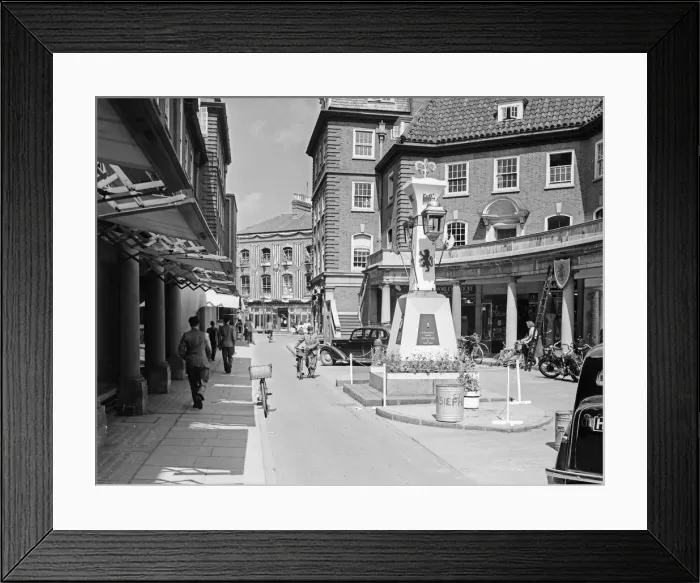 Framed Print : Flags fluttering in the breeze, decorations in traditional colours lining the streets Framed Print : Flags fluttering in the breeze, decorations in traditional colours lining the streets