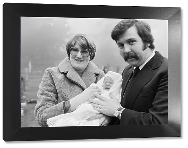 PC Graham Browne and his wife Yvonne pose with their eight week old baby son Clive Brown