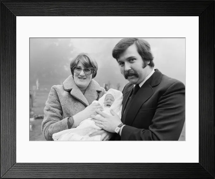 Framed Print : PC Graham Browne and his wife Yvonne pose with their eight week old baby son Clive Brown Framed Print : PC Graham Browne and his wife Yvonne pose with their eight week old baby son Clive Brown