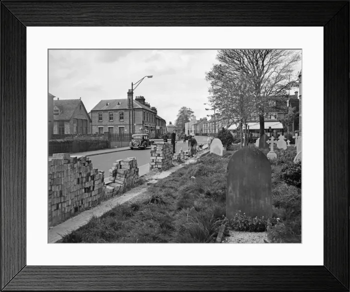 Framed Print : Council workman building a new wall during the alterations to Victoria Road, Cambridge