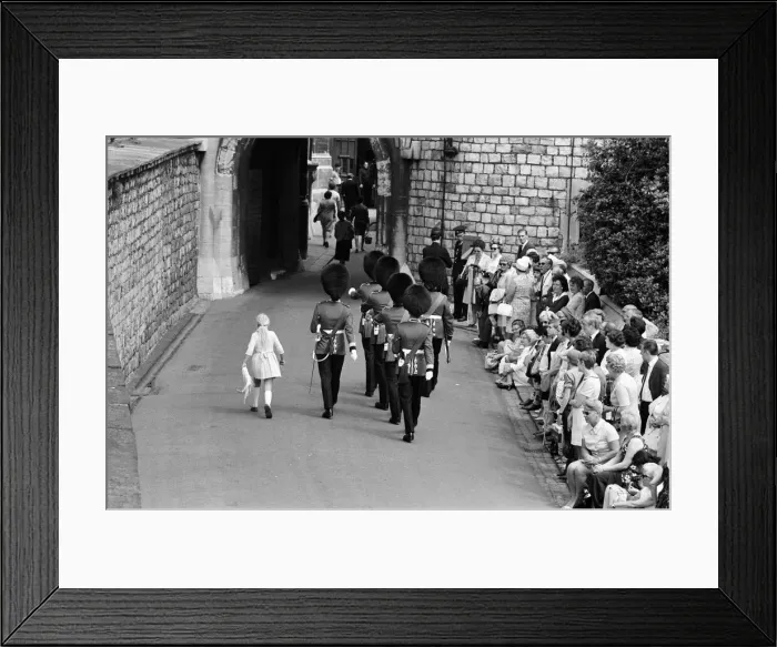 Framed Print : Garter Procession at Windsor Castle. A little girl joins the Guards as they march into