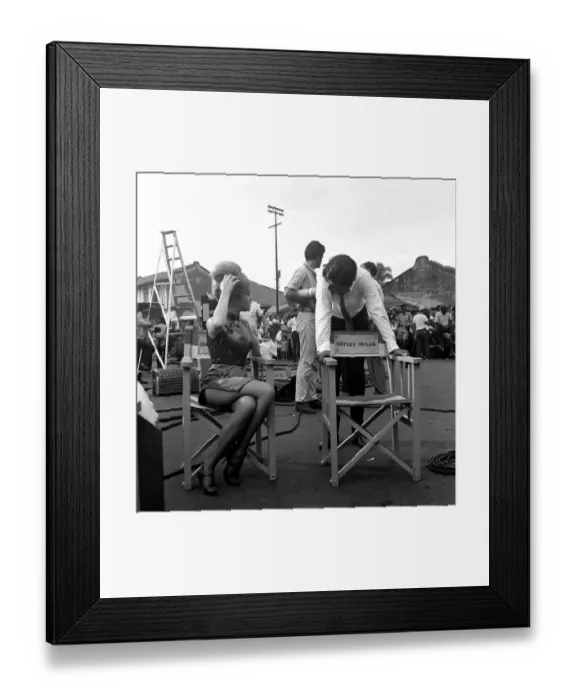 Framed Print : A new-look Hayley Mills in Chinese Make-up and a cheongsam on location in Singapore