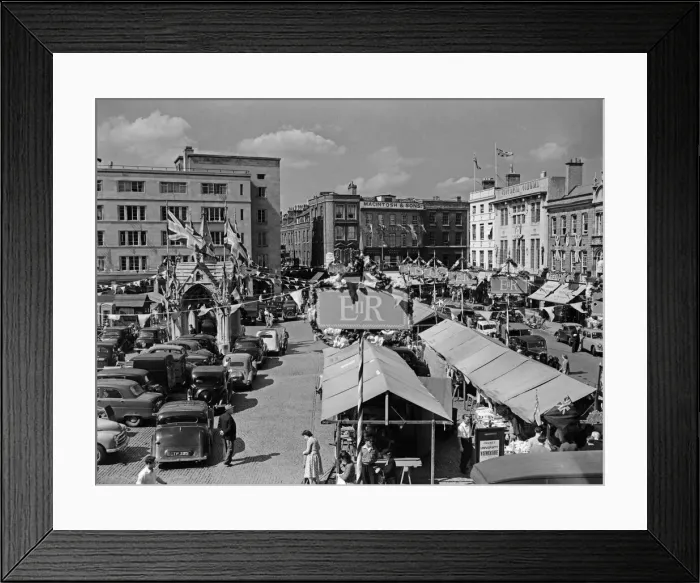 Framed Print : Flags fluttering in the breeze, decorations in traditional colours lining the streets Framed Print : Flags fluttering in the breeze, decorations in traditional colours lining the streets