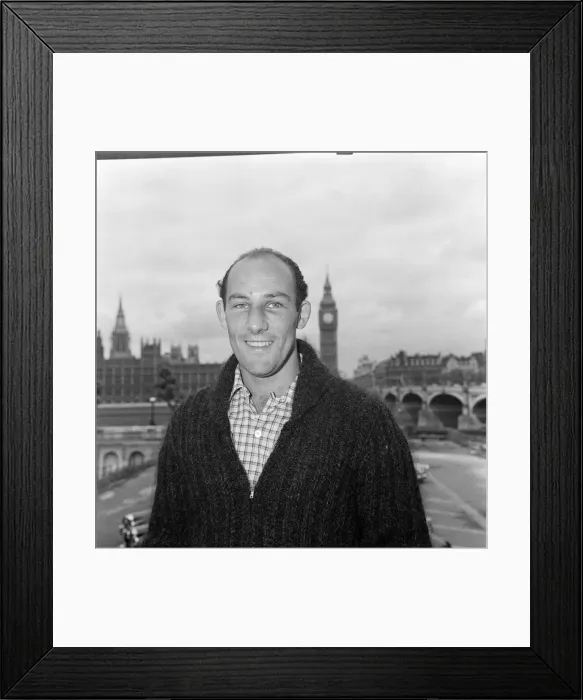 Framed Print : Stirling Moss in the grounds of St Thomas Hospital at Westminster, London Framed Print : Stirling Moss in the grounds of St Thomas Hospital at Westminster, London