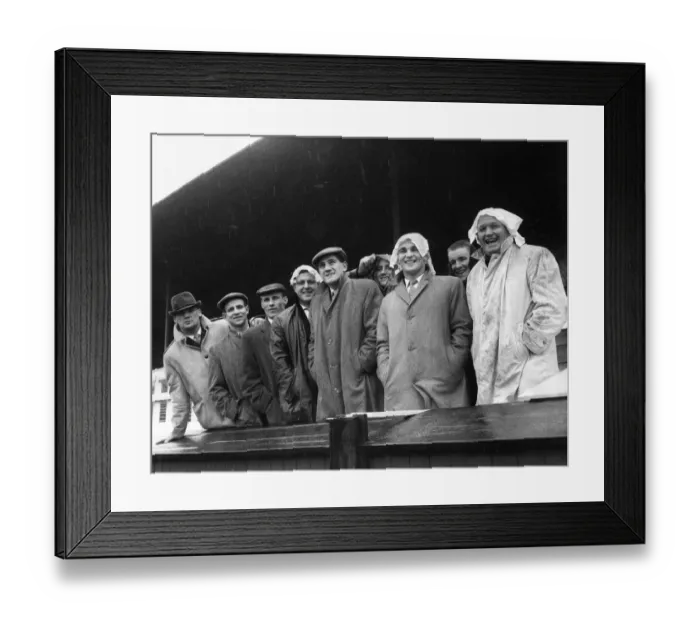 Framed Print : Members of the Wakefield rugby league team look pleased as they watch the rain lash down Framed Print : Members of the Wakefield rugby league team look pleased as they watch the rain lash down