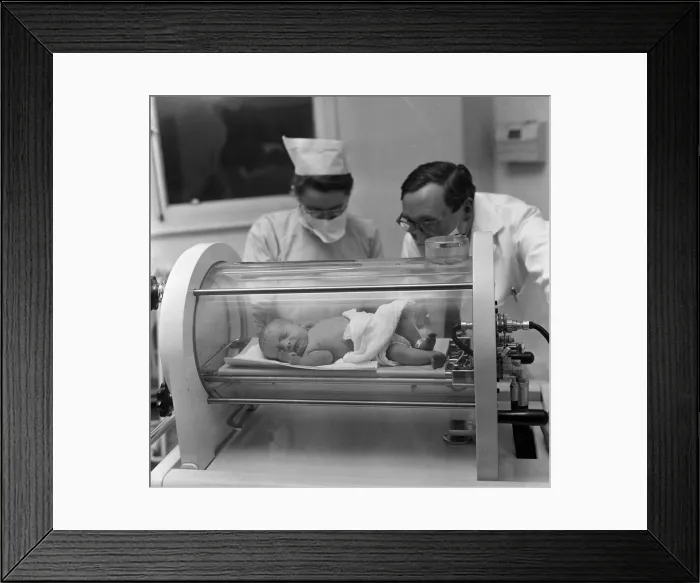 Framed Print : A premature baby in one of the machines that can save new born babies Framed Print : A premature baby in one of the machines that can save new born babies