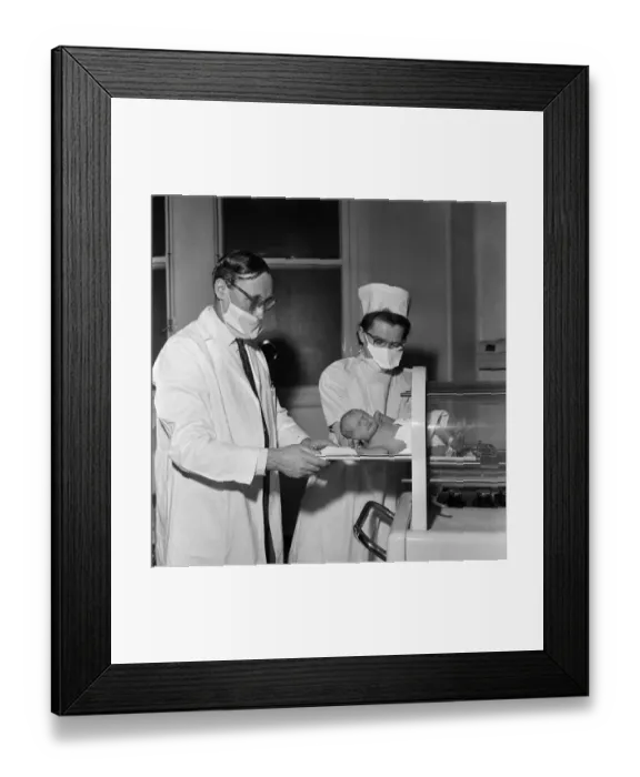Framed Print : A premature baby in one of the machines that can save new born babies