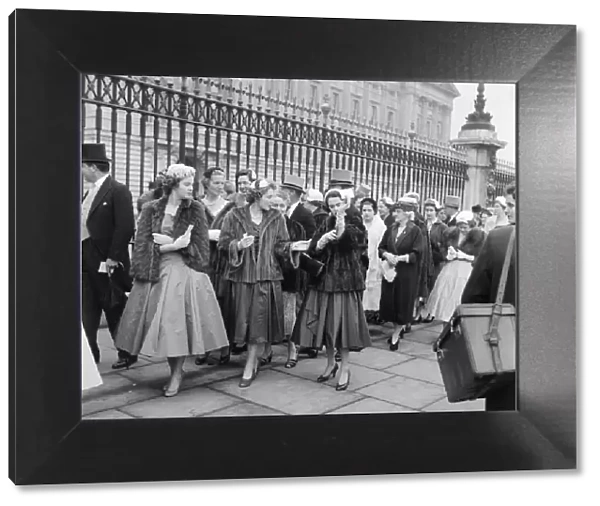 Debutantes queue at Buckingham Palace this morning to meet Queen Elizabeth II