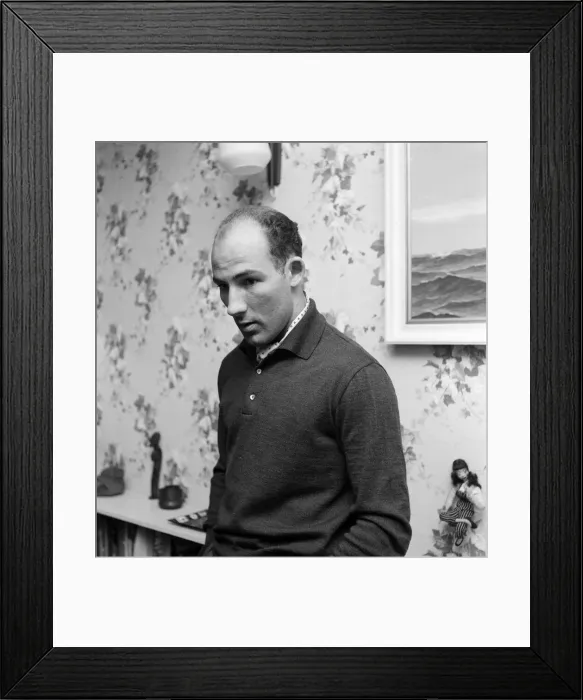 Framed Print : Y2K Stirling Moss 1960 racing driver at his home in Shepherd Street Mayfair London