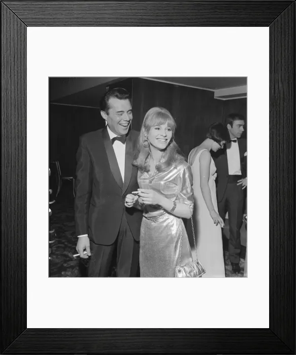 Framed Print : Julie Christie and Dirk Bogarde celebrate their film award win each Framed Print : Julie Christie and Dirk Bogarde celebrate their film award win each