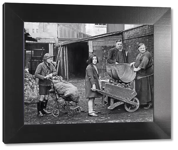 Children collecting their coal ration from a coal merchant near Birmingham City centre