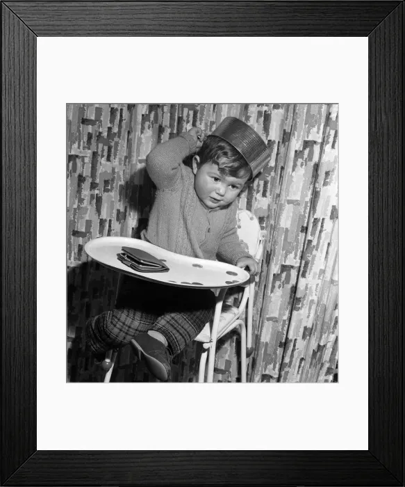 Framed Print : 21 month old John Lockey, of Perivale, with the baking tin that he wore as a hat Framed Print : 21 month old John Lockey, of Perivale, with the baking tin that he wore as a hat