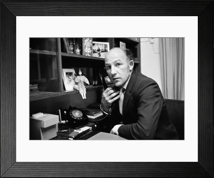 Framed Print : Stirling Moss pictured in his office / home in Shepherds Market, London. 3rd August 1973 Framed Print : Stirling Moss pictured in his office / home in Shepherds Market, London. 3rd August 1973