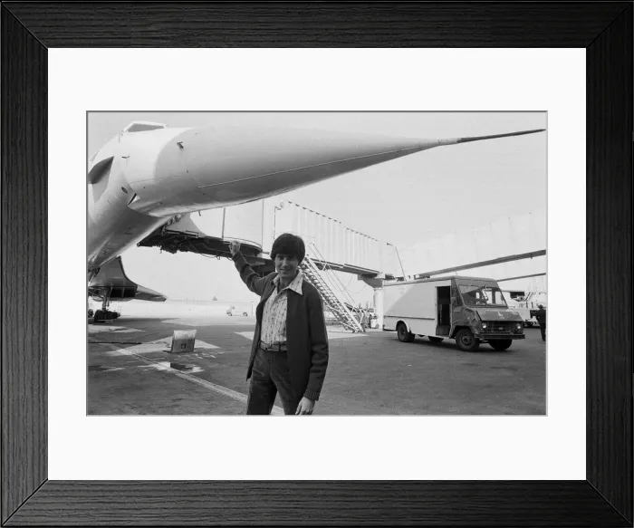 Framed Print : Uri Geller at London Airport standing in front of a Concorde. 1st November 1978 Framed Print : Uri Geller at London Airport standing in front of a Concorde. 1st November 1978
