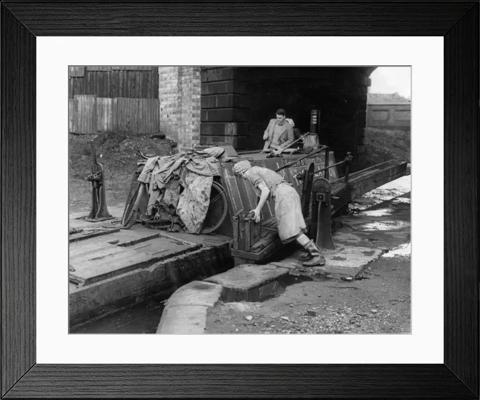 Framed Print : Hard Realities: Its a man-sized job shifting a huge timbered canal narrow boat Framed Print : Hard Realities: Its a man-sized job shifting a huge timbered canal narrow boat