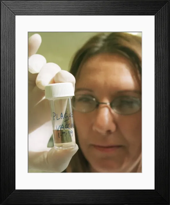 Framed Print : Porton Down September 1999 Scientist holding Vial of Plague Vaccine in Building 422 -