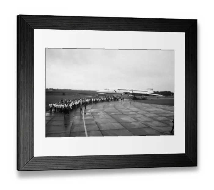 Framed Print : Hundreds of people were drenched by heavy rain as they pulled Concorde around an airfield
