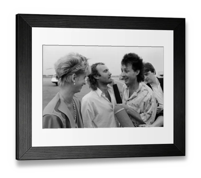 Framed Print : Singer Phil Collins & wife Jill Travelman at London Heathrow Airport Framed Print : Singer Phil Collins & wife Jill Travelman at London Heathrow Airport