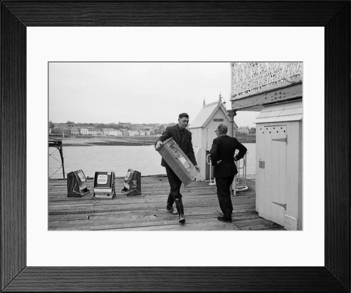 Framed Print : Three one-armed bandits which have been marooned for a weekend at Clevedon, Somerset Framed Print : Three one-armed bandits which have been marooned for a weekend at Clevedon, Somerset