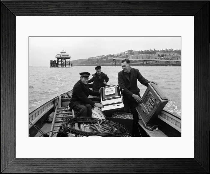 Framed Print : Three one-armed bandits which have been marooned for a weekend at Clevedon, Somerset Framed Print : Three one-armed bandits which have been marooned for a weekend at Clevedon, Somerset