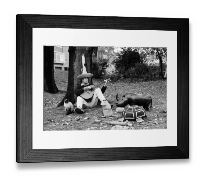 Framed Print : John Cleese relaxing in the garden of his home in Holland Park Framed Print : John Cleese relaxing in the garden of his home in Holland Park