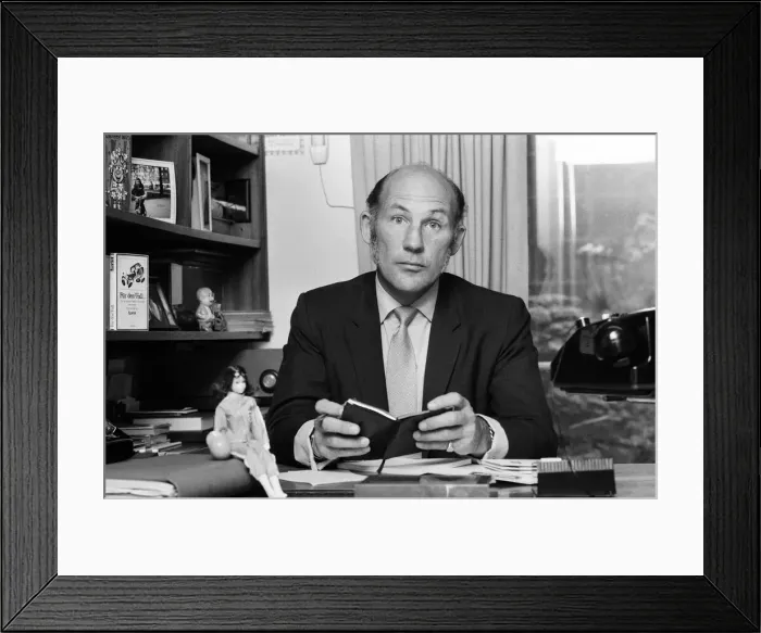 Framed Print : Stirling Moss pictured in his office / home in Shepherds Market, London. 3rd August 1973 Framed Print : Stirling Moss pictured in his office / home in Shepherds Market, London. 3rd August 1973
