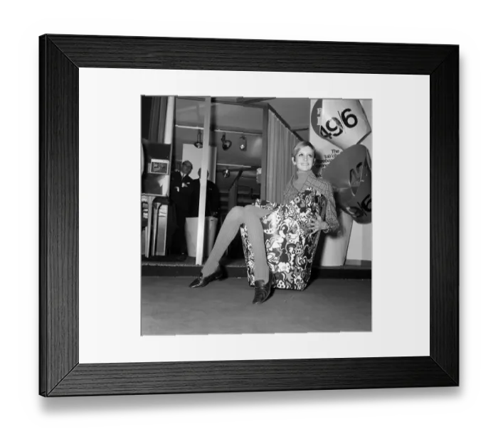 Framed Print : Twiggy sitting in a paper chair at the Ideal Home Exhibition. 6th March 1967 Framed Print : Twiggy sitting in a paper chair at the Ideal Home Exhibition. 6th March 1967
