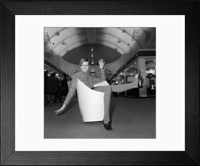 Framed Print : Twiggy sitting in a paper chair at the Ideal Home Exhibition. 6th March 1967