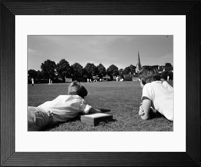 Framed Print : A cricket match takes place in the village of Wombourne in Staffordshire, England Framed Print : A cricket match takes place in the village of Wombourne in Staffordshire, England