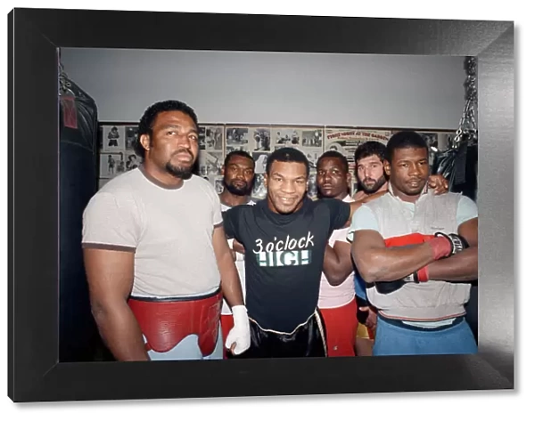 Mike Tyson with sparring partners ahead of his bout with James Bonecrusher Smith