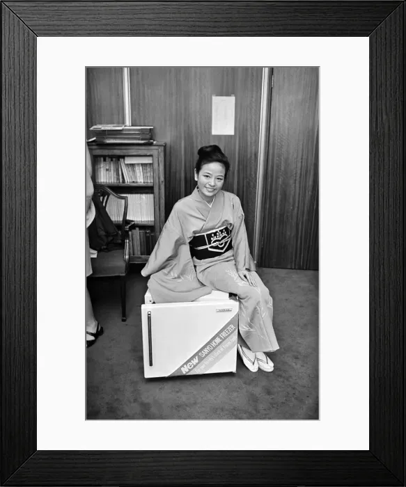 Framed Print : A woman wearing a Kimono sitting on a Japanese food freezer. 26th July 1965 Framed Print : A woman wearing a Kimono sitting on a Japanese food freezer. 26th July 1965