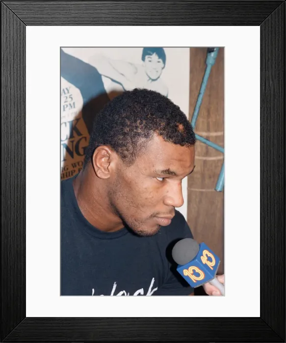 Framed Print : Mike Tyson takes a break from training ahead of his bout with James Bonecrusher Smith Framed Print : Mike Tyson takes a break from training ahead of his bout with James Bonecrusher Smith
