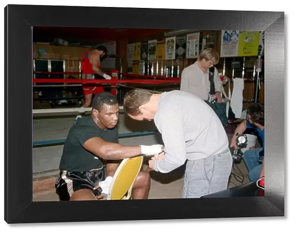 Mike Tyson in his training camp with trainer Kevin Rooney ahead of his bout with James