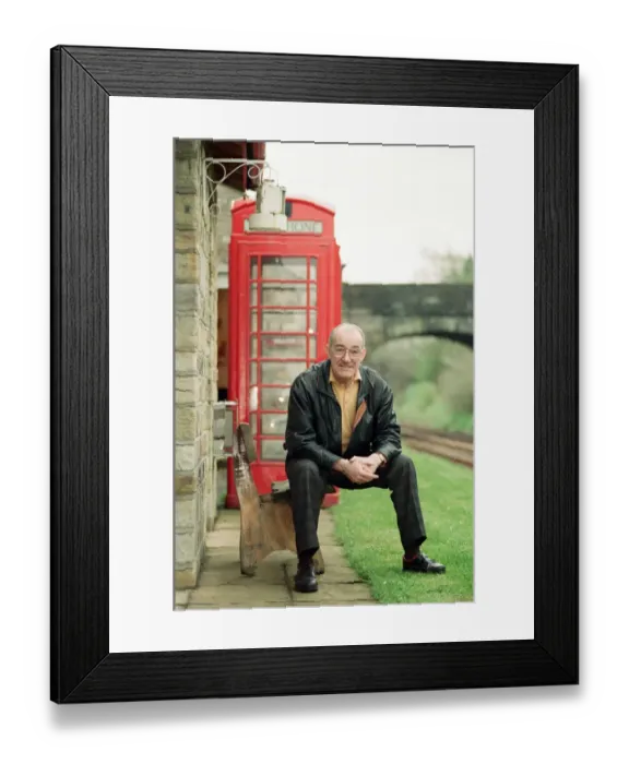 Framed Print : Jim Bowen by the railway which passes by his house in Arkholme, Lancashire